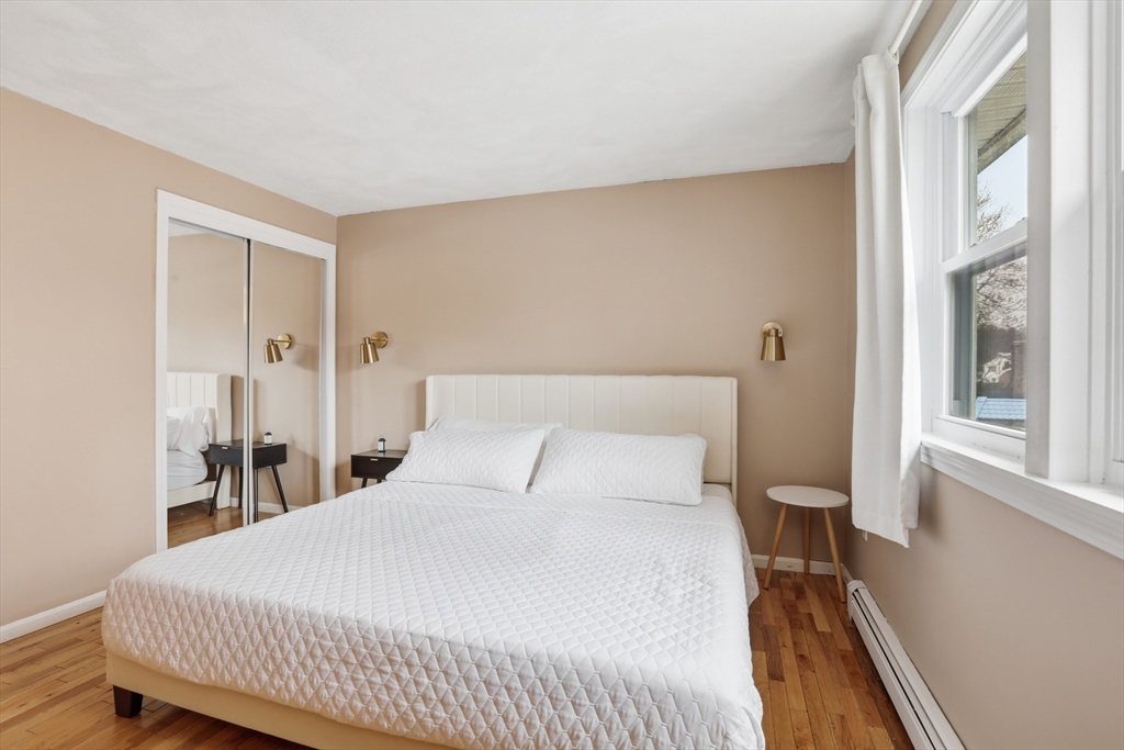 24 Clark Street Salem, MA 01970 - Photo 13 of 38 a bedroom with a bed and a window