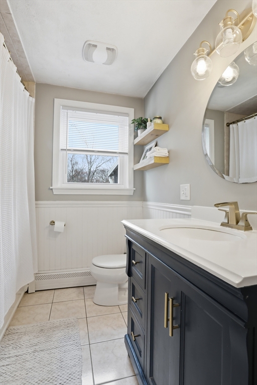 24 Clark Street Salem, MA 01970 - Photo 18 of 38 a bathroom with a sink a toilet and mirror