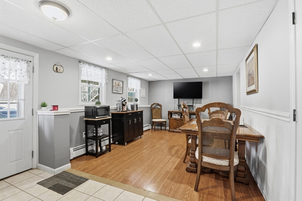 24 Clark Street Salem, MA 01970 - Photo 22 of 38 a view of a dining room with furniture and a window