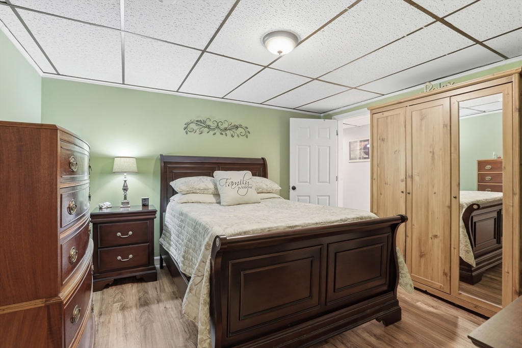 24 Clark Street Salem, MA 01970 - Photo 26 of 38 a bedroom with a bed and a dresser