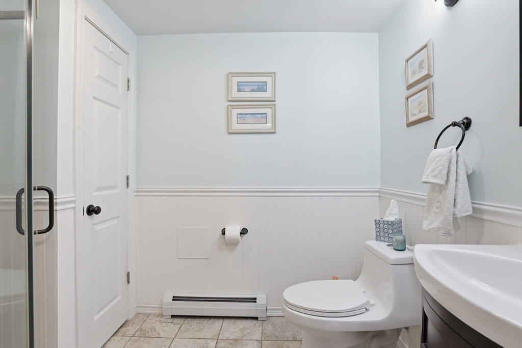 24 Clark Street Salem, MA 01970 - Photo 27 of 38 a bathroom with a toilet and a shower