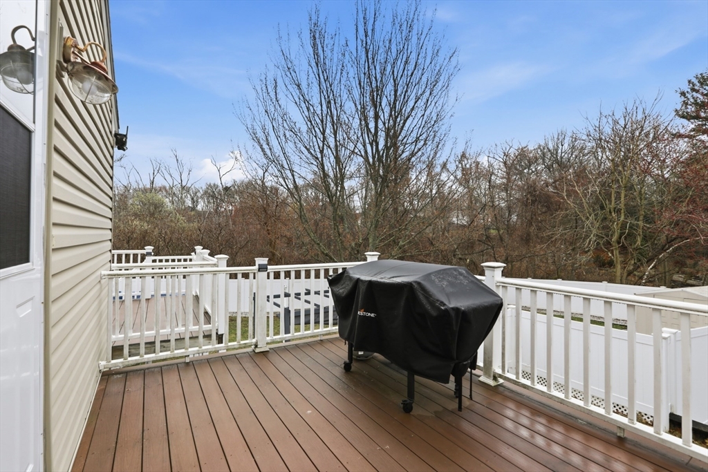 24 Clark Street Salem, MA 01970 - Photo 30 of 38 a view of balcony with wooden floor and fence