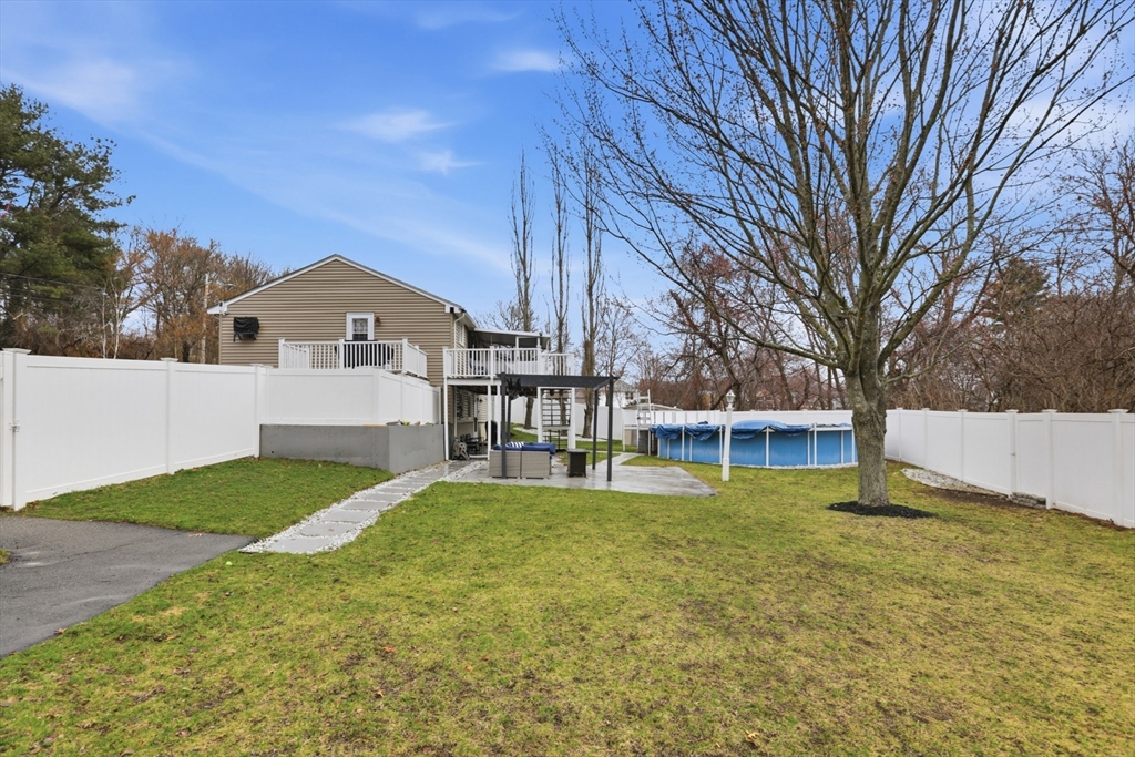 24 Clark Street Salem, MA 01970 - Photo 31 of 38 a view of a house with a yard and large trees