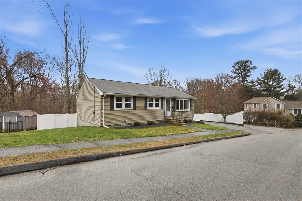 24 Clark Street Salem, MA 01970 - Photo 37 of 38 a view of a house with a big yard and large tree