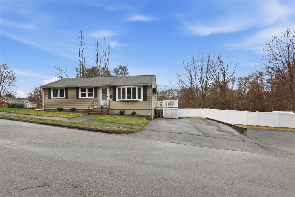 24 Clark Street Salem, MA 01970 - Photo 38 of 38 a view of swimming pool with outdoor seating and house in the background