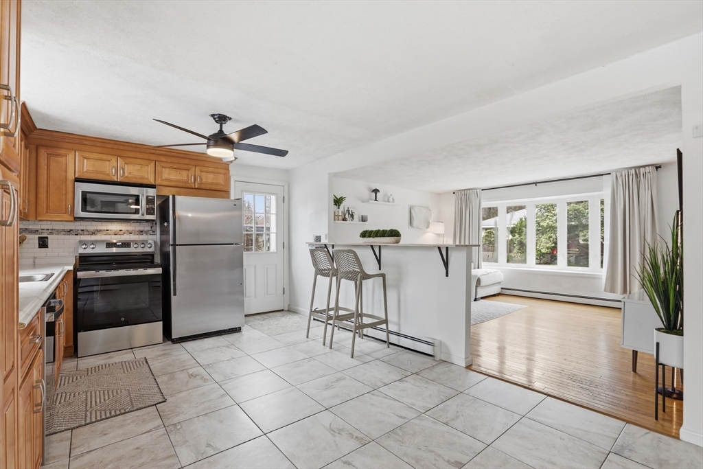 24 Clark Street Salem, MA 01970 - Photo 8 of 38 a kitchen with a refrigerator and a sink
