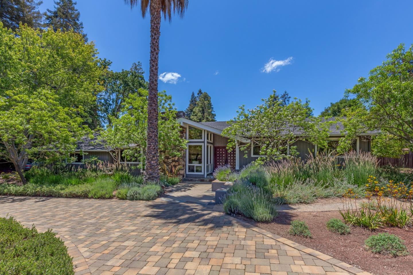 a front view of a house with garden