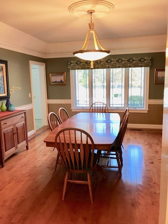 11 Kate's Lane Boxford, MA 01921 - Photo 12 of 30 a dining room with furniture a chandelier and wooden floor