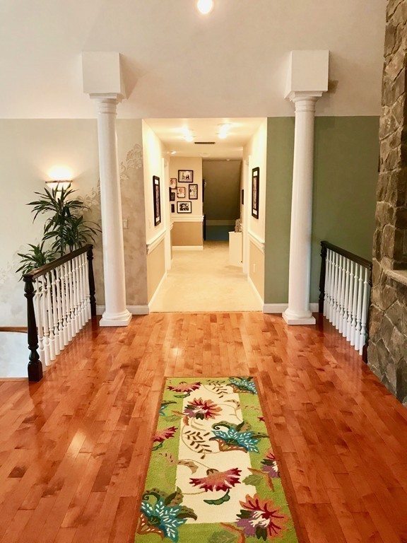 11 Kate's Lane Boxford, MA 01921 - Photo 23 of 30 a hallway with beautiful frames and flower vase