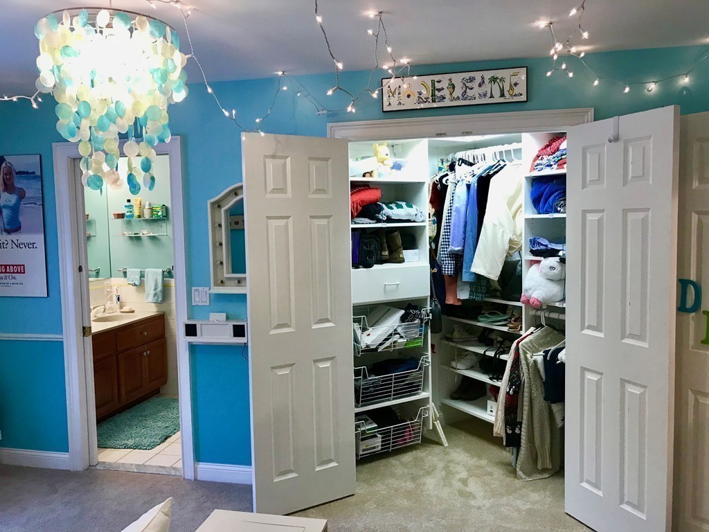 11 Kate's Lane Boxford, MA 01921 - Photo 25 of 30 a view of walk in closet with clothes and shoes