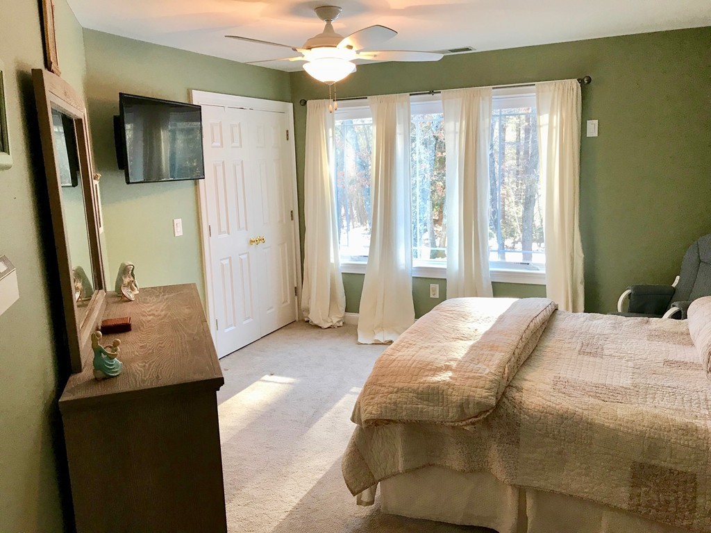 11 Kate's Lane Boxford, MA 01921 - Photo 29 of 30 a bedroom with a bed dresser and a window