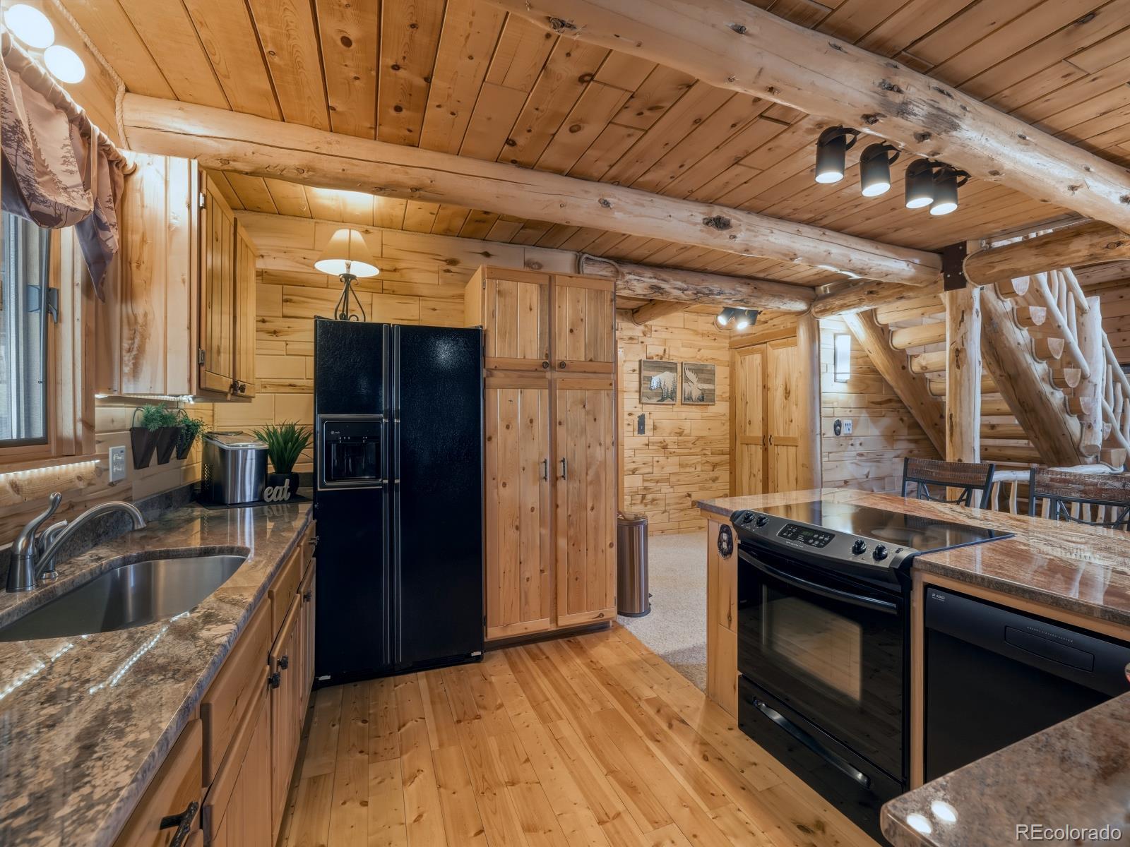 341 Anderson Road Walden, CO 80480 - Photo 28 of 50 a kitchen with a sink stove and refrigerator