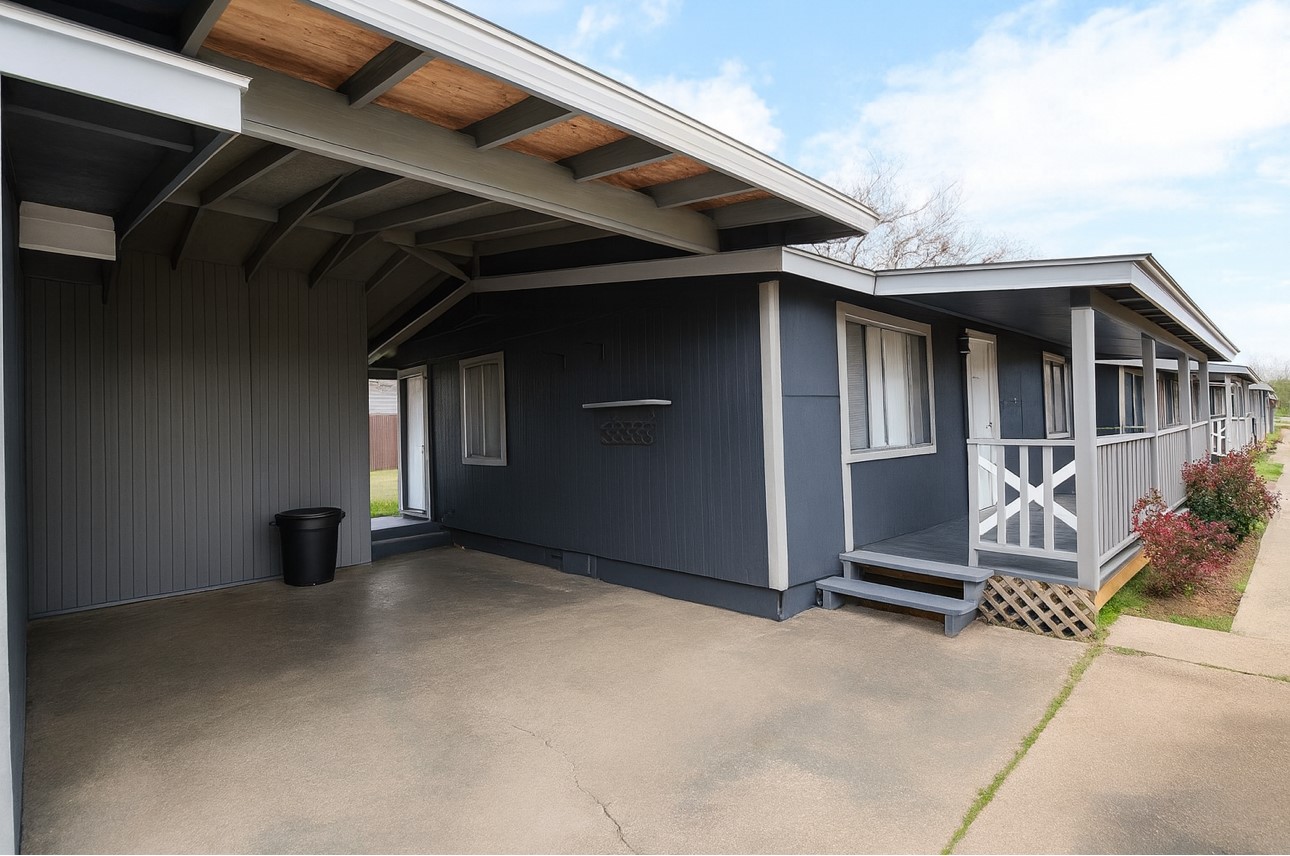 123 Stavena Road, Unit 3 Wharton, TX 77488 - Photo 2 of 9 a view of an empty room with wooden floor and a window