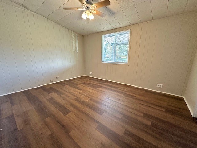 123 Stavena Road, Unit 3 Wharton, TX 77488 - Photo 5 of 9 an empty room with wooden floor fan and windows