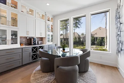 a living room with kitchen island furniture and a large window