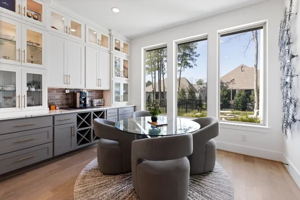 a living room with kitchen island furniture and a large window
