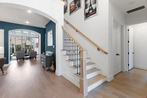 a view of entryway and hall with wooden floor