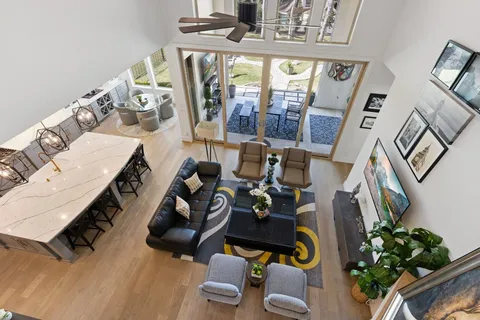 a view of living room with furniture and floor to ceiling windows