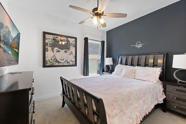 a bed room with a bed and a chandelier
