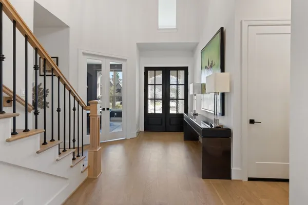 a view of a livingroom with furniture and staircase