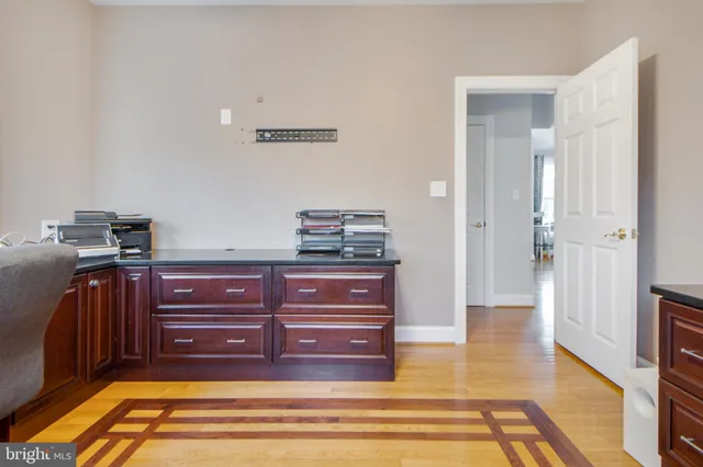 a view of kitchen with furniture and refrigerator