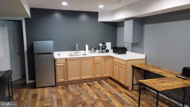 a view of a chairs and table in the balcony