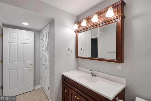 a view of a house with pool and sitting area