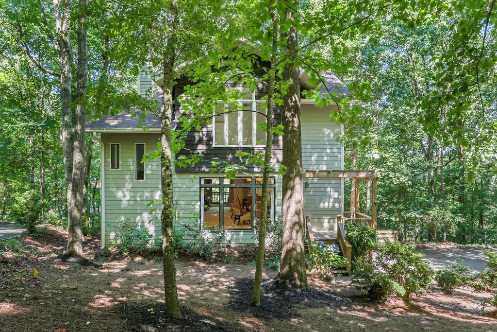 470 Chimney Bluff Alpharetta, GA 30022 - Photo 1 of 1 a backyard of a house with lots of green space