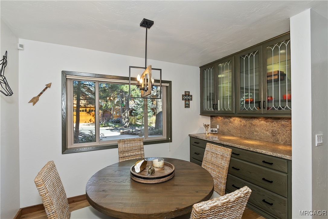 39343 Aurora Road Big Bear Lake, CA 92315 - Photo 17 of 50 a view of a dining room with furniture window and outside view