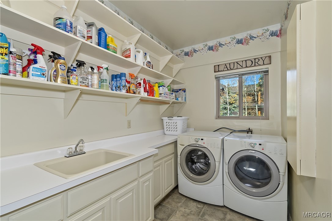 39343 Aurora Road Big Bear Lake, CA 92315 - Photo 18 of 50 a utility room with dryer washer and a sink