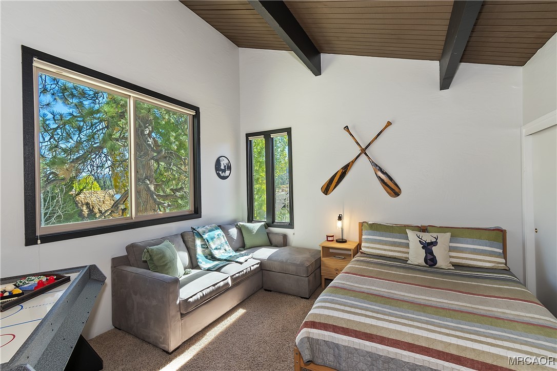 39343 Aurora Road Big Bear Lake, CA 92315 - Photo 32 of 50 a bedroom with furniture and a large window