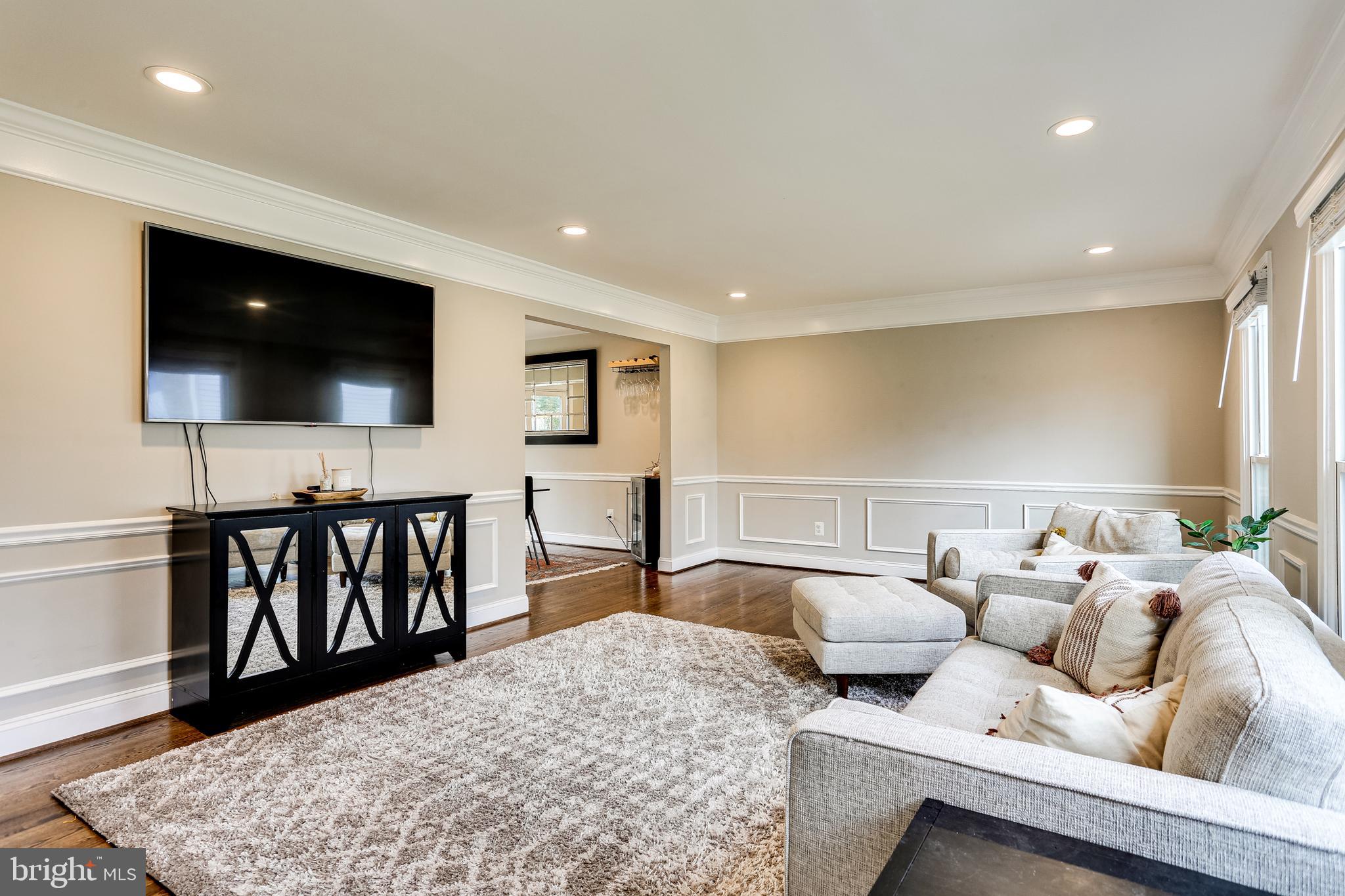 Living room with wainscotting & crown molding