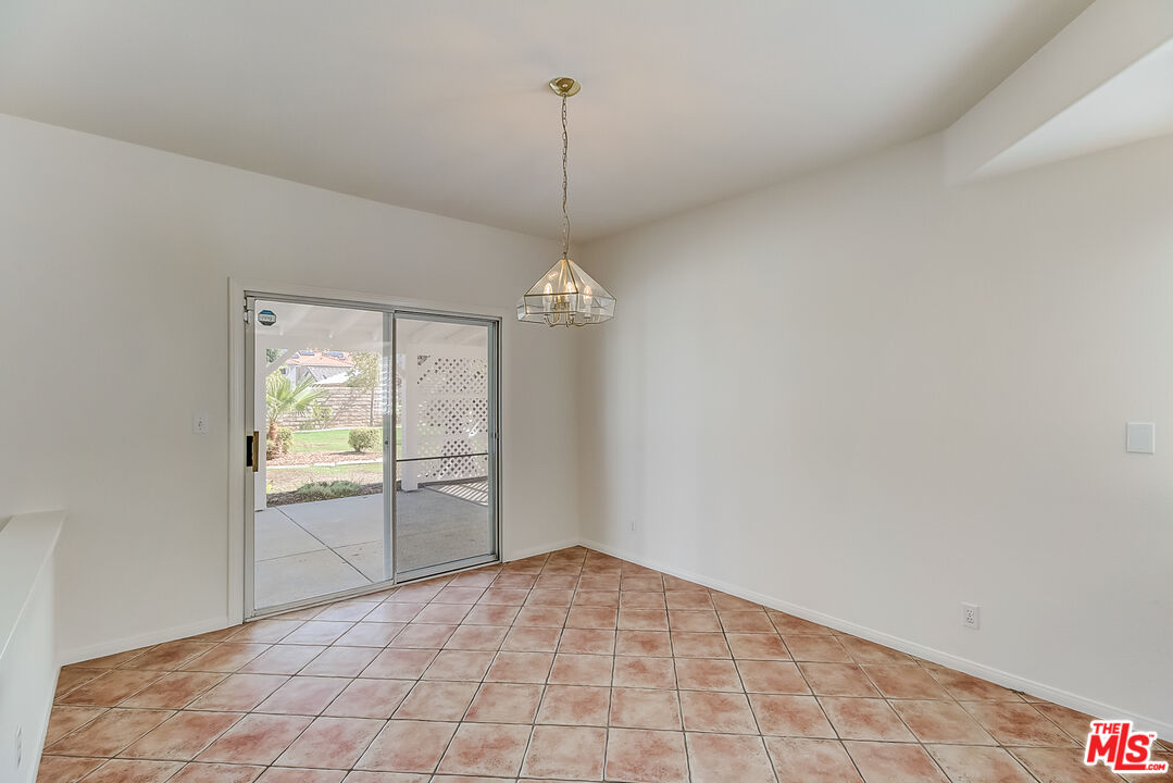 41908 Pico Way Palmdale, CA 93551 - Photo 26 of 35 a view of an empty room with a fireplace