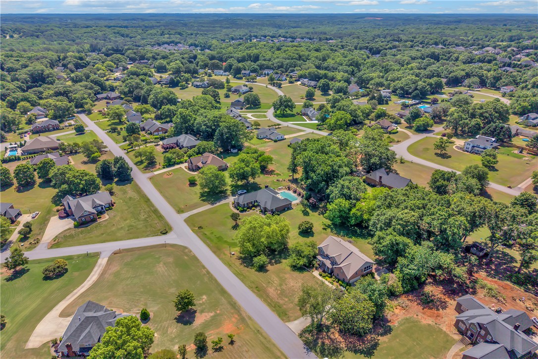 406 Hopewell Ridge Anderson, SC 29621 - Photo 45 of 46 An aerial perspective reveals a sprawling residential area surrounded by lush green landscapes.