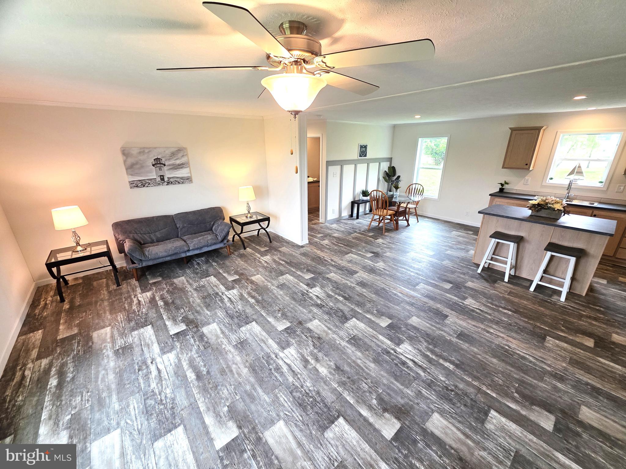 289 Grove Neck Road Earleville, MD 21919 - Photo 5 of 19 a living room with furniture and a wooden floor