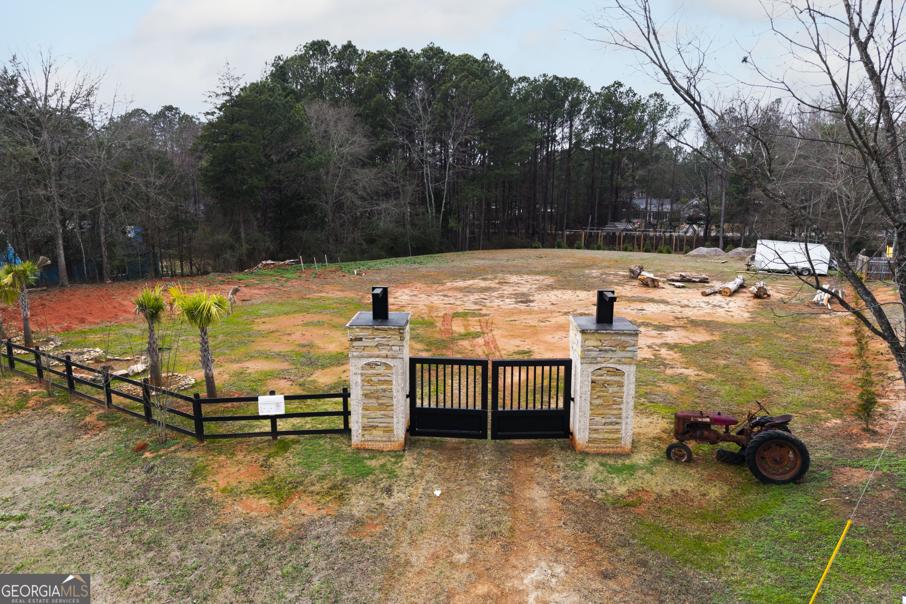 1462 Bethany Road Covington, GA 30016 - Photo 3 of 13 a view of a swimming pool with a patio and a yard