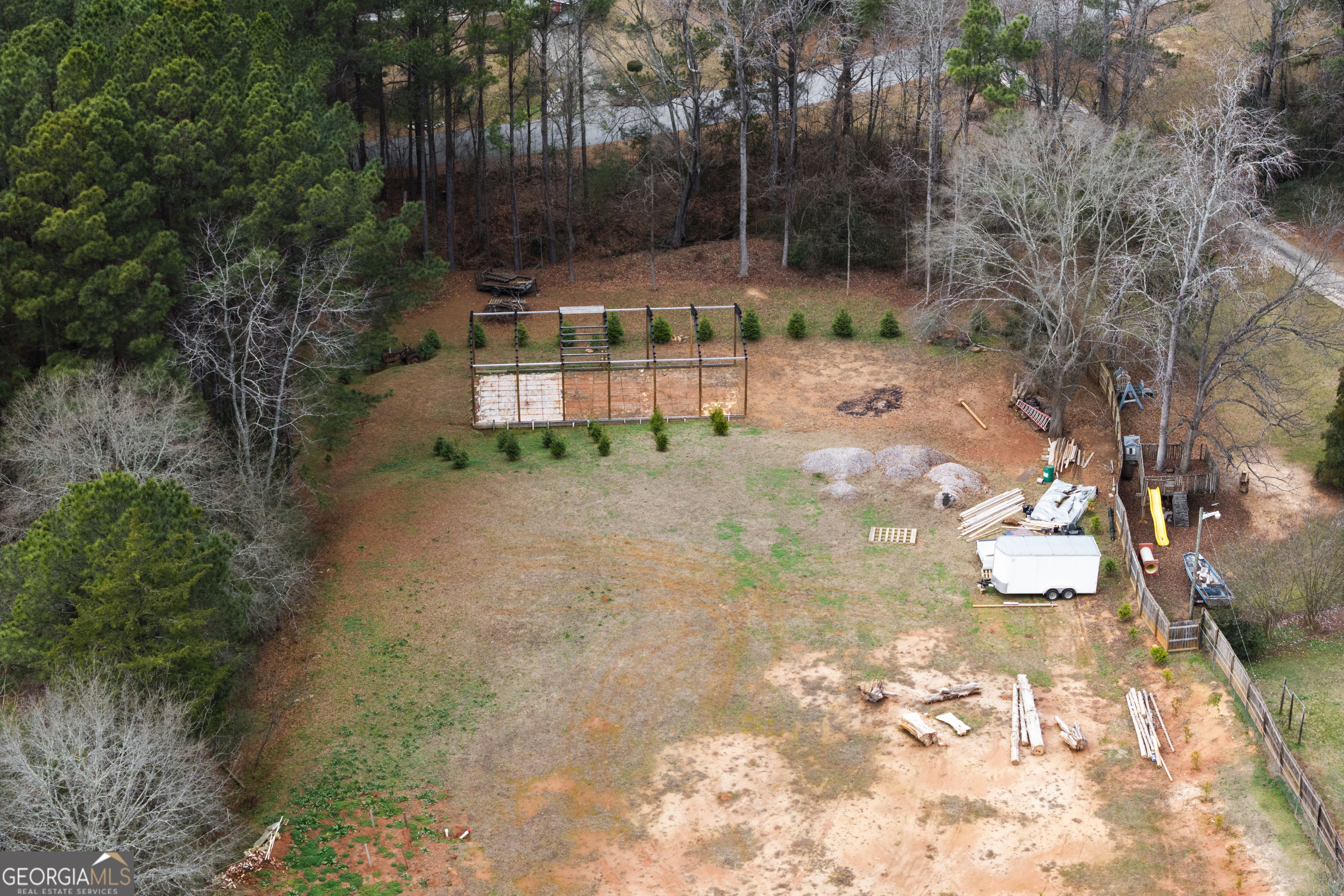 1462 Bethany Road Covington, GA 30016 - Photo 5 of 13 a view of a yard with plants and trees