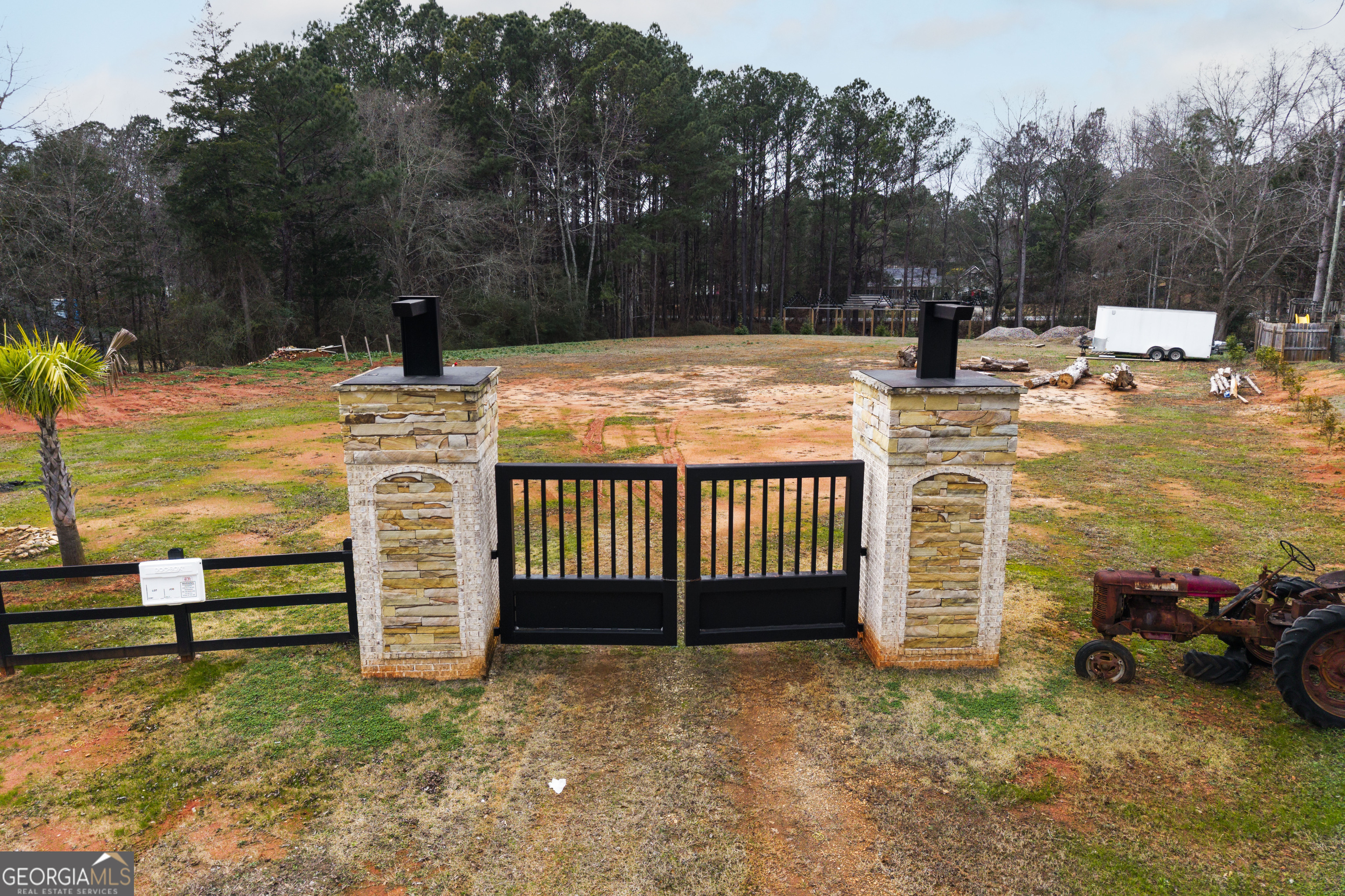 1462 Bethany Road Covington, GA 30016 - Photo 6 of 13 a view of a yard with large tree