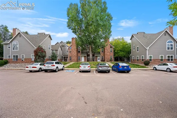 a view of a city street with parked cars