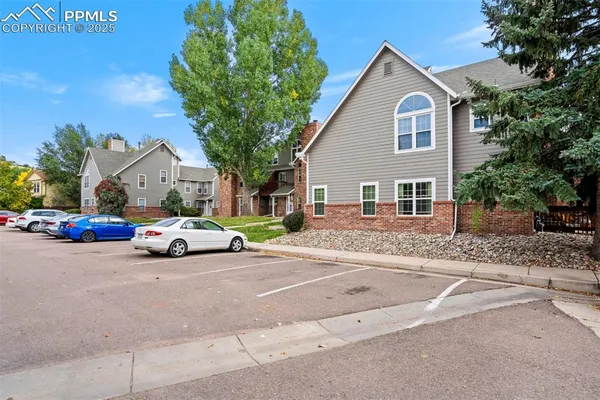 a view of a car parked in front of a house
