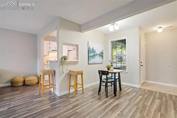 a view of a livingroom with furniture and wooden floor