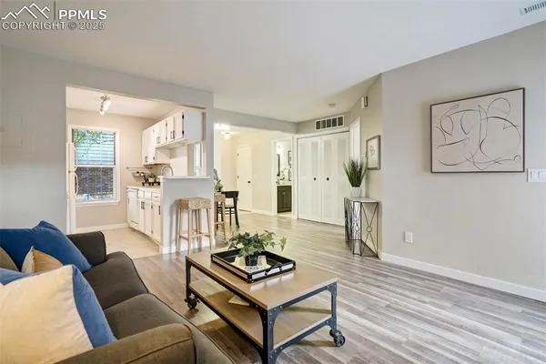 a living room with furniture and a table