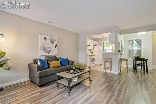 a living room with furniture and a table