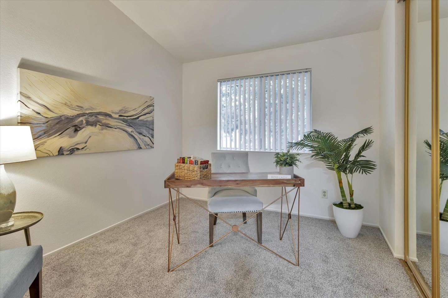 563 Shadow Dance Drive San Jose, CA 95110 - Photo 15 of 30 a view of a workspace with furniture and a potted plant