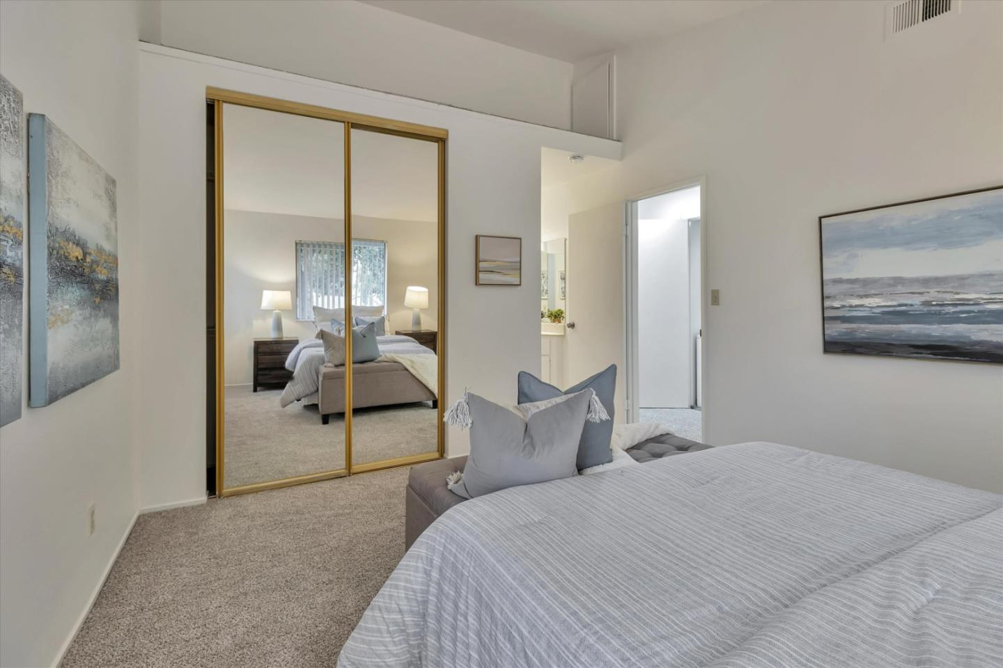 563 Shadow Dance Drive San Jose, CA 95110 - Photo 19 of 30 a bedroom with a bed and glass door