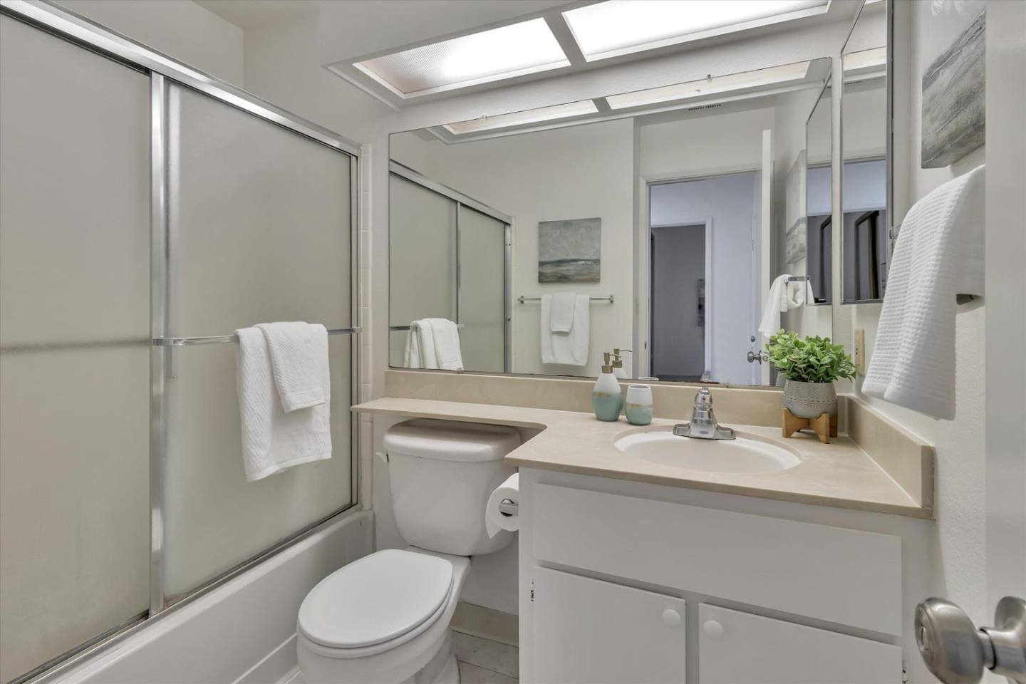 563 Shadow Dance Drive San Jose, CA 95110 - Photo 21 of 30 a bathroom with a sink toilet and shower