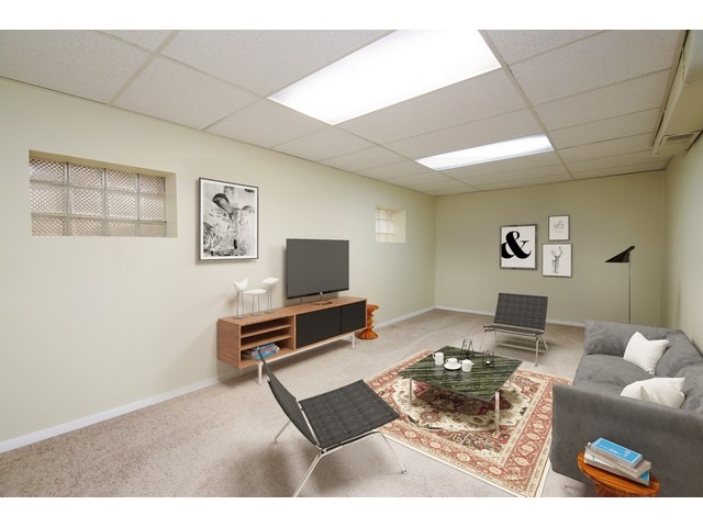 558 Green Bay Road Glencoe, IL 60022 - Photo 5 of 10 a living room with furniture and a flat screen tv