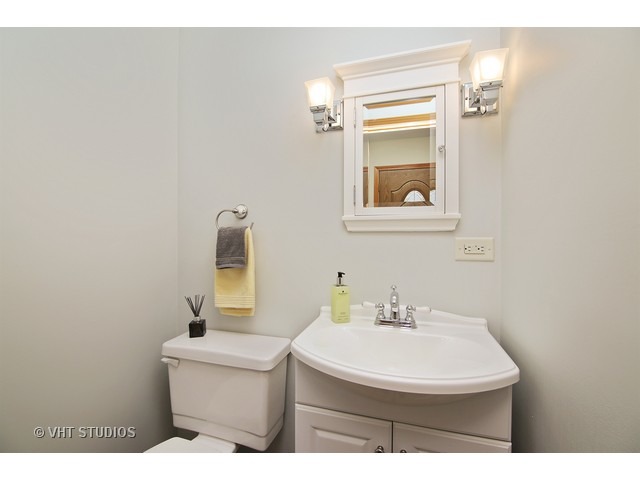 558 Green Bay Road Glencoe, IL 60022 - Photo 9 of 10 a bathroom with a sink a mirror and window