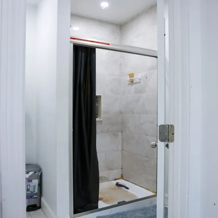 a bathroom with a toilet a sink and vanity
