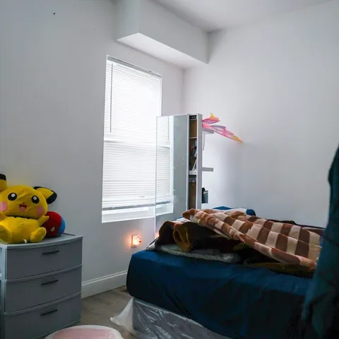 a kitchen with a table and chairs in it